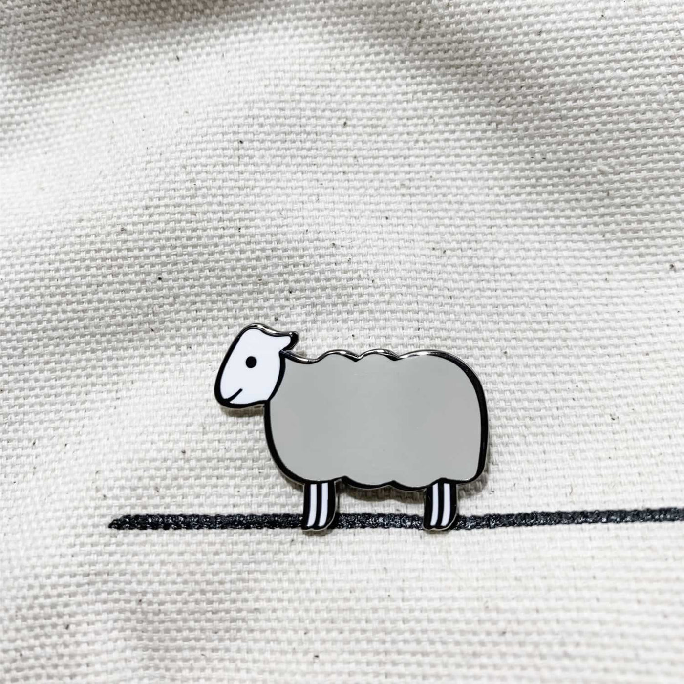 Sheep Enamel Pin on Material
