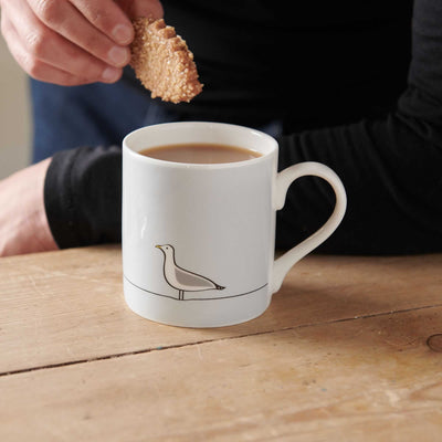 Seagull Mug with biscuit and dunking