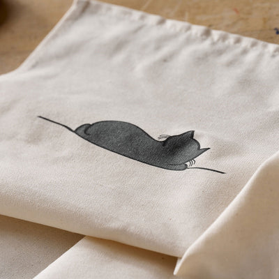 Sleeping Cat Tea Towel on table