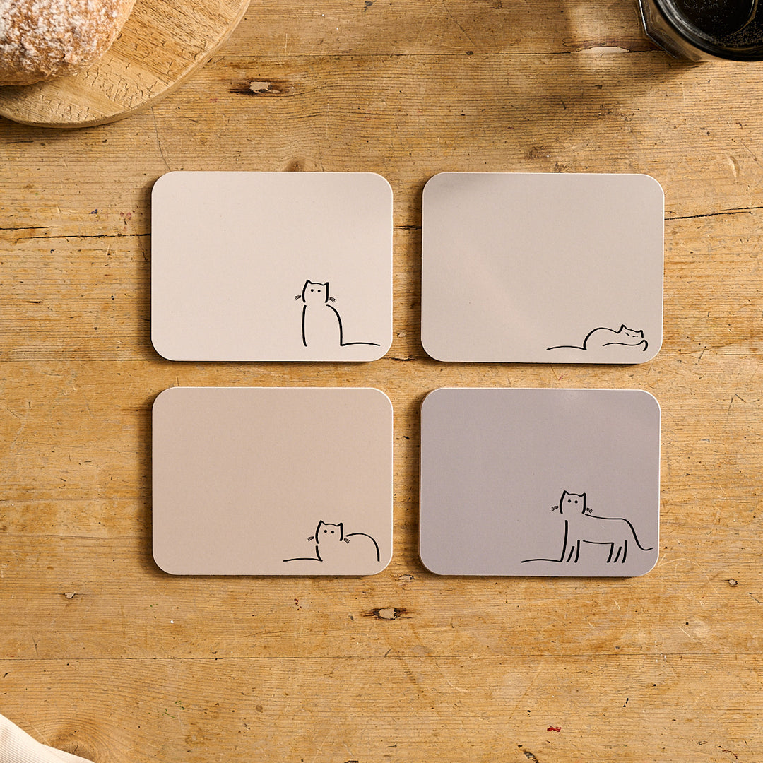 Four neutral shade coasters with Waiting Cat, Loafing Cat, Dreaming Cat and Watching Cat