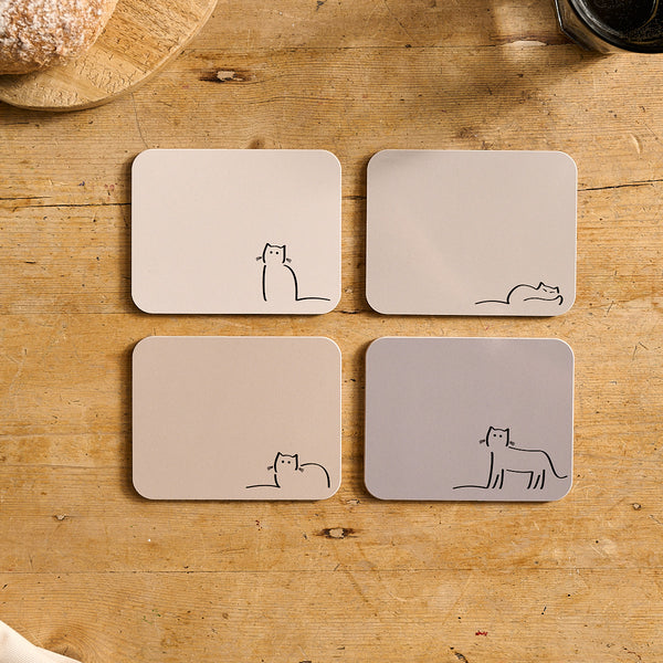 Four neutral shade coasters with Waiting Cat, Loafing Cat, Dreaming Cat and Watching Cat