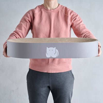 CatLoaf Extra Large Oval Cat Scratcher Bed 63cm x 35cm in hands