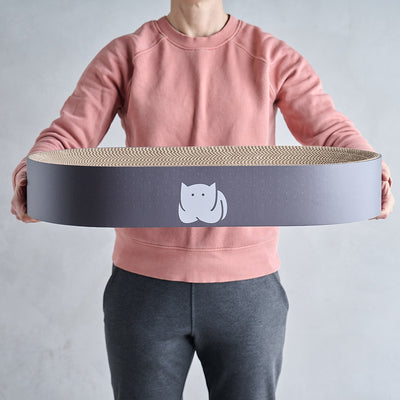 CatLoaf Extra Large Oval Cat Scratcher Bed 63cm x 35cm in hands