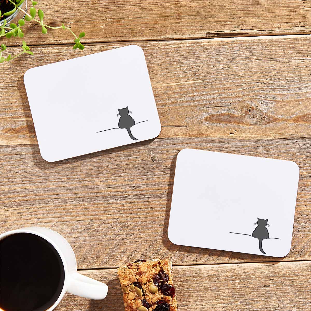 Crouching Cat Coasters on table with flapjack