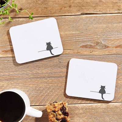 Crouching Cat Coasters on table with flapjack