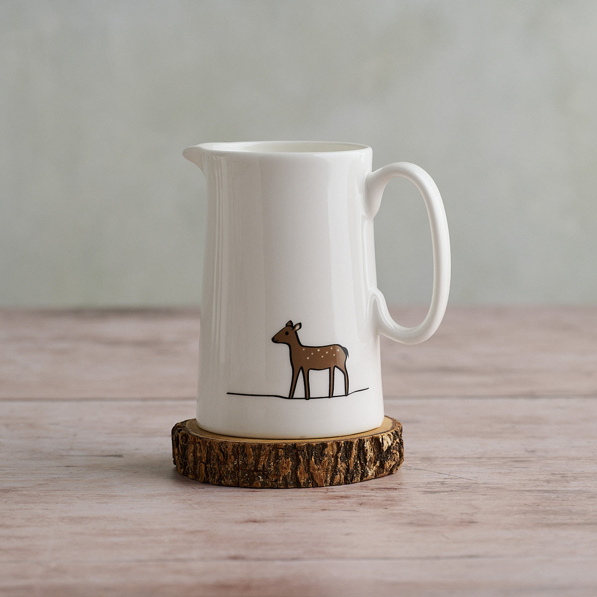 Deer Jug 330ml on a wooden coaster