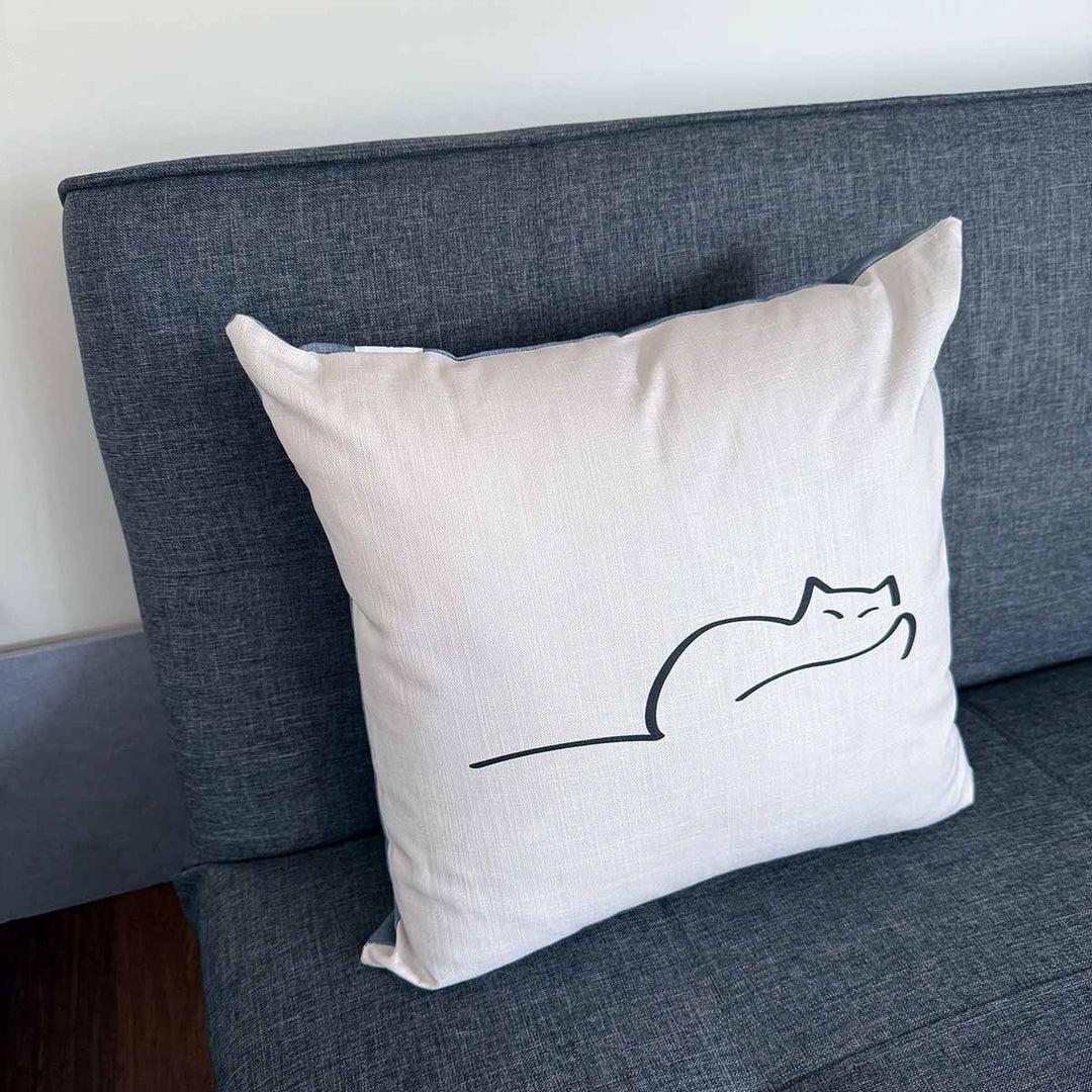 Dreaming Cat Cushion on sofa