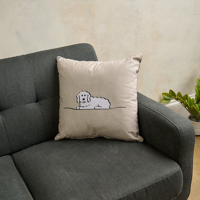 Fluffy Dog Cushion on Grey Sofa