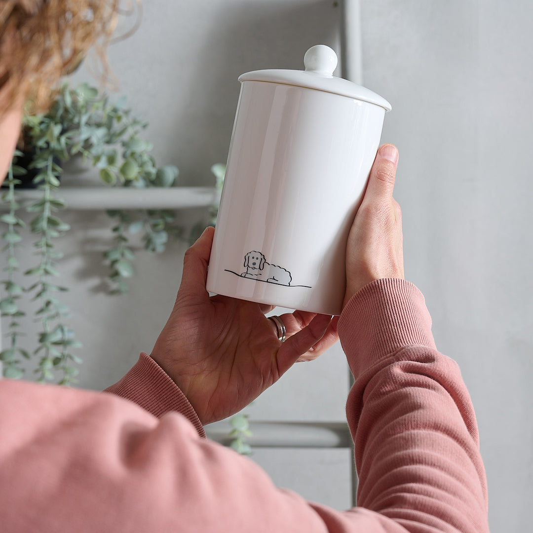 Fluffy Dog Storage Jar in hands