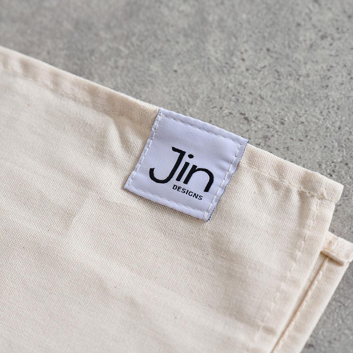 Jin Designs logo label on tea towel