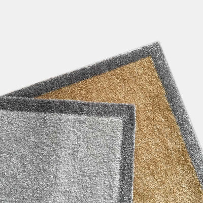 Close-up of a Jin Designs Doormat in grey and natural on a white background