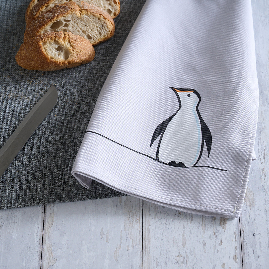 Penguin Tea Towel on table