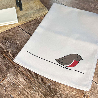 Robin Tea Towel on table