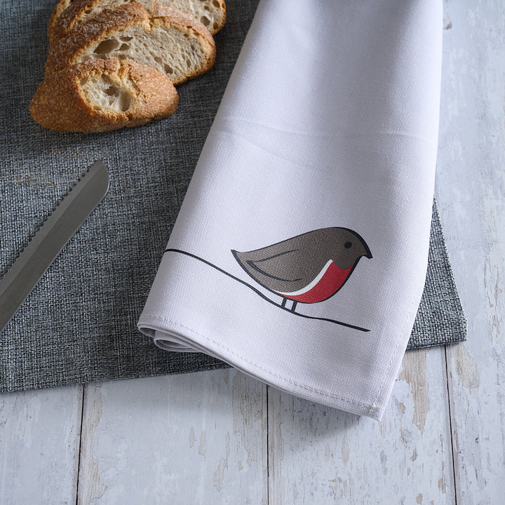 Robin Tea Towel on table