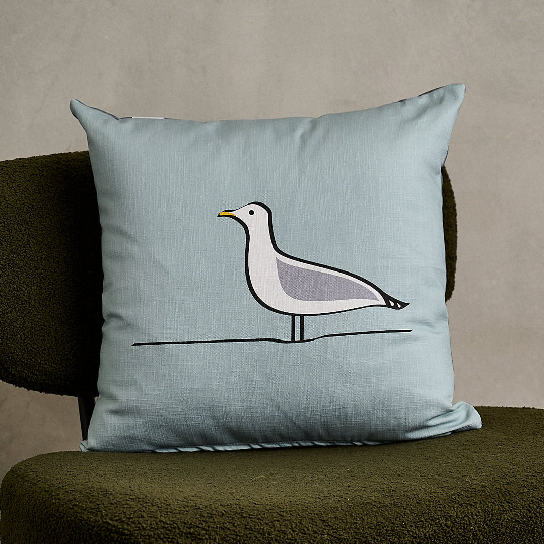 Seagull Cushion on green sofa chair