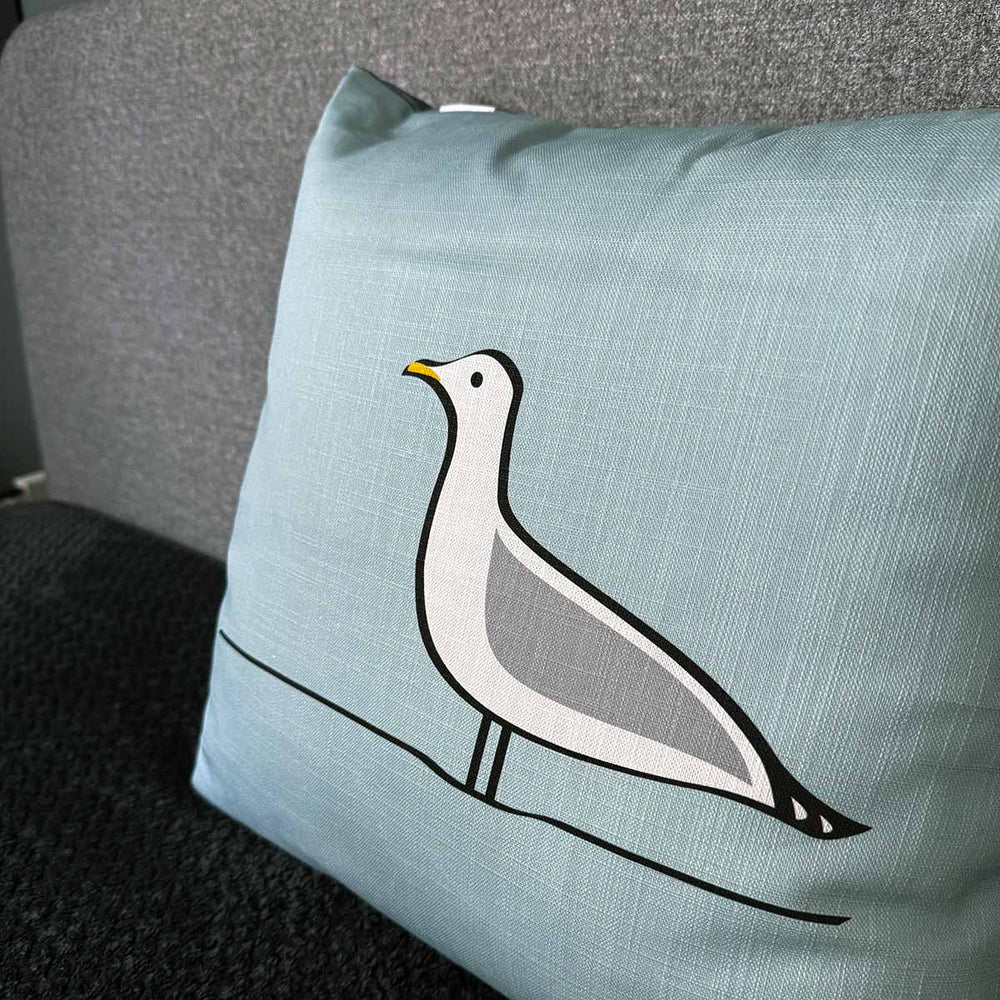 Seagull Cushion on bed close up

