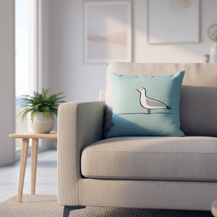 Seagull Cushion on sofa in beach house living room with plant