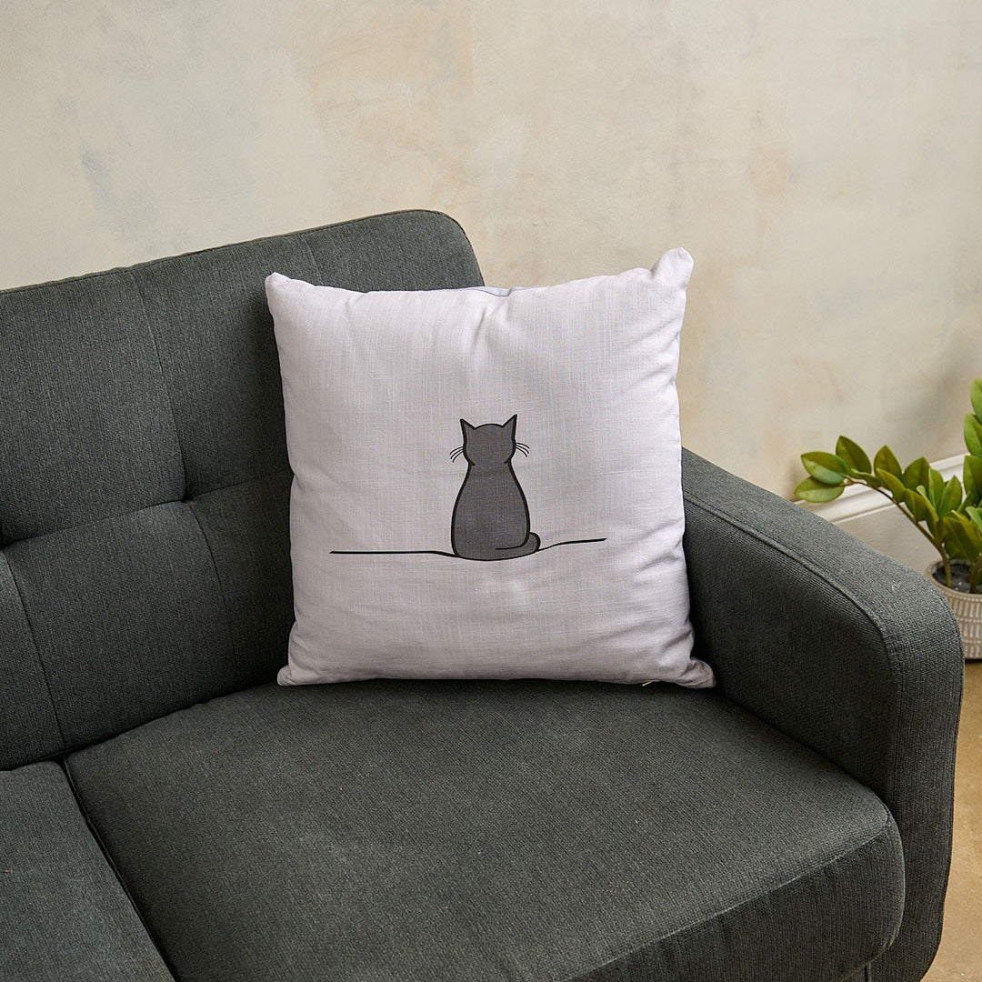 Sitting Cat Cushion on Grey Sofa