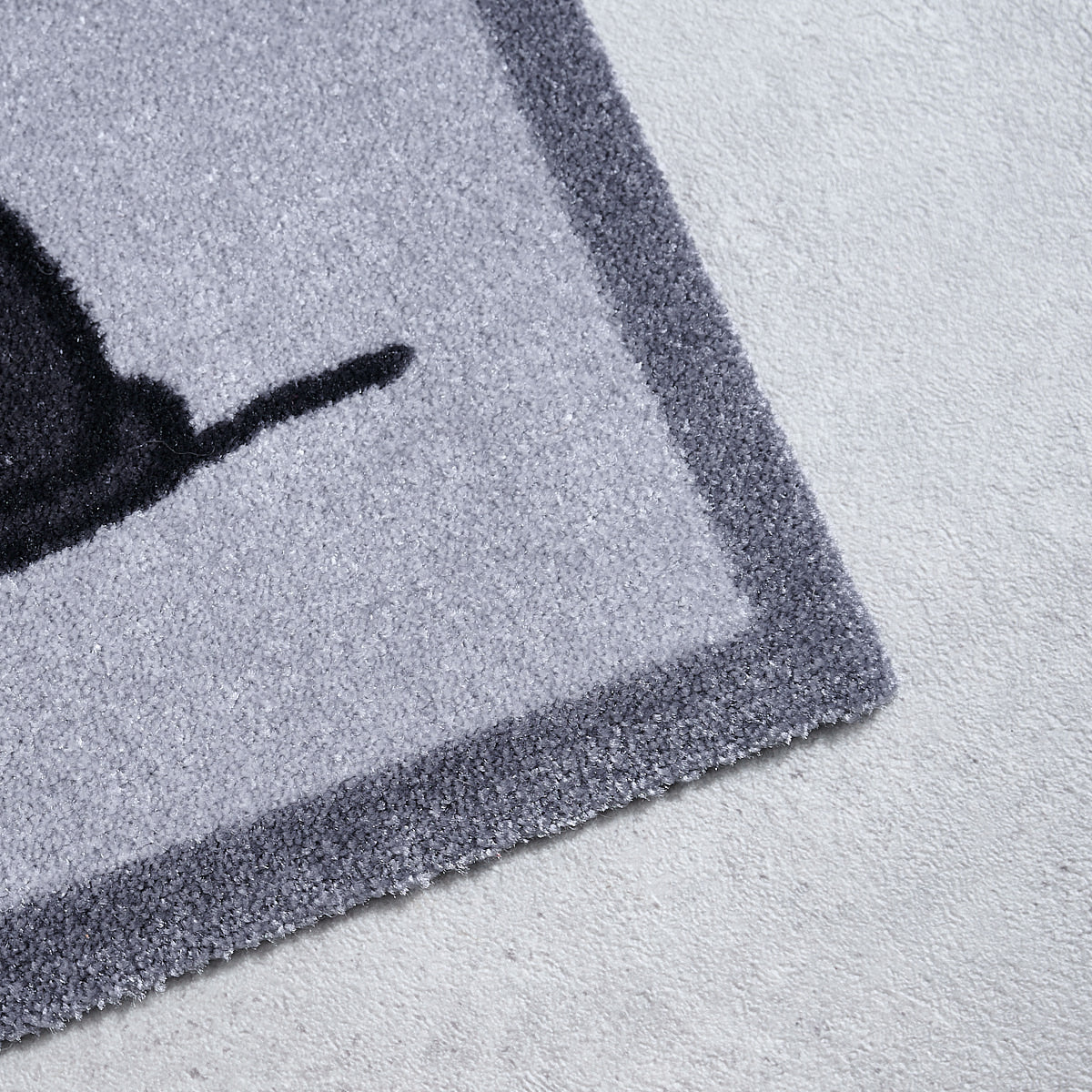 Close up of doormat corner in grey