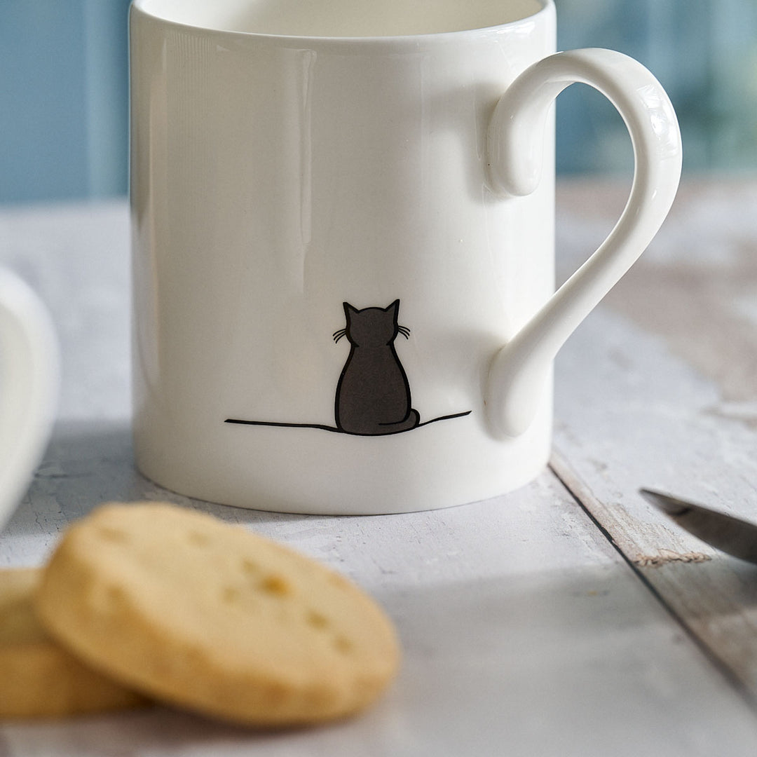 Sitting Cat Mug close up with shortbread biscuits