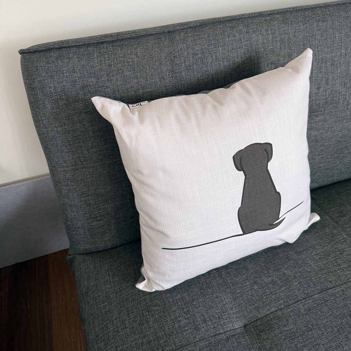 Sitting Dog Cushion on sofa