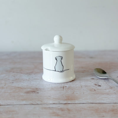 White fine bone china jam pot with Sitting Dog illustration on a wooden surface