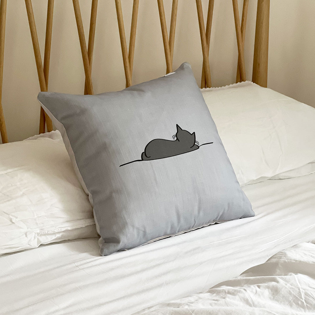 Sleeping Cat Cushion on Bed