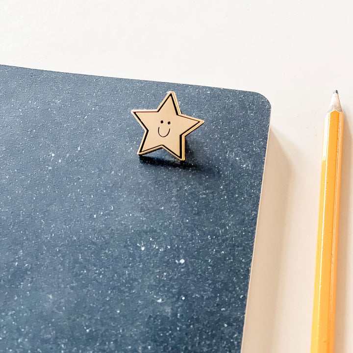 Star Pin on Notebook close up