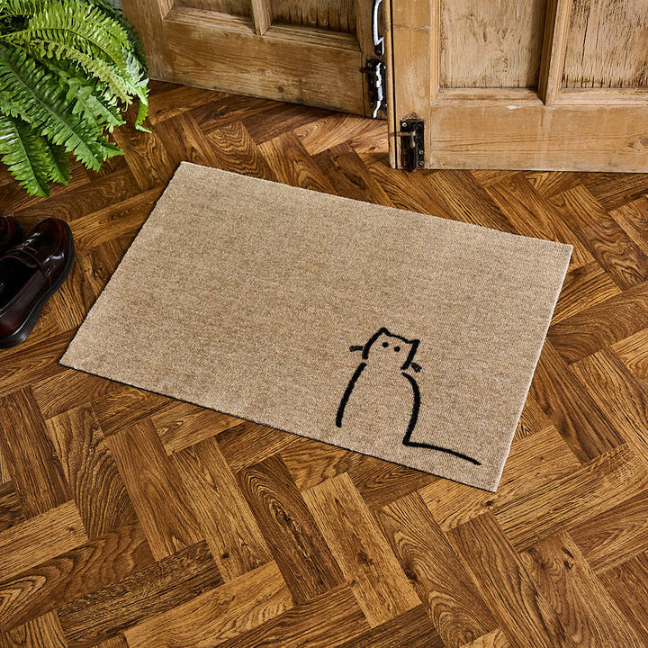 Waiting Cat Doormat by the door with shoes and plant