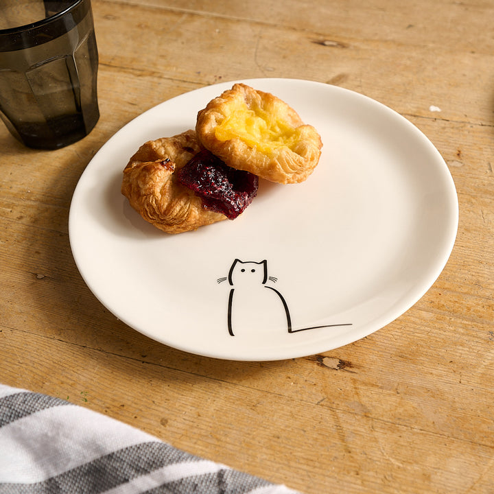 Loafing Cat Side Plate and pastries on a wooden table