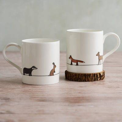 Two Woodland Collection Large Mugs showing front and reverse with Badger, Fox, Deer and Rabbit