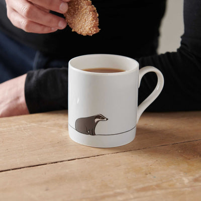 Badger Mug with biscuit