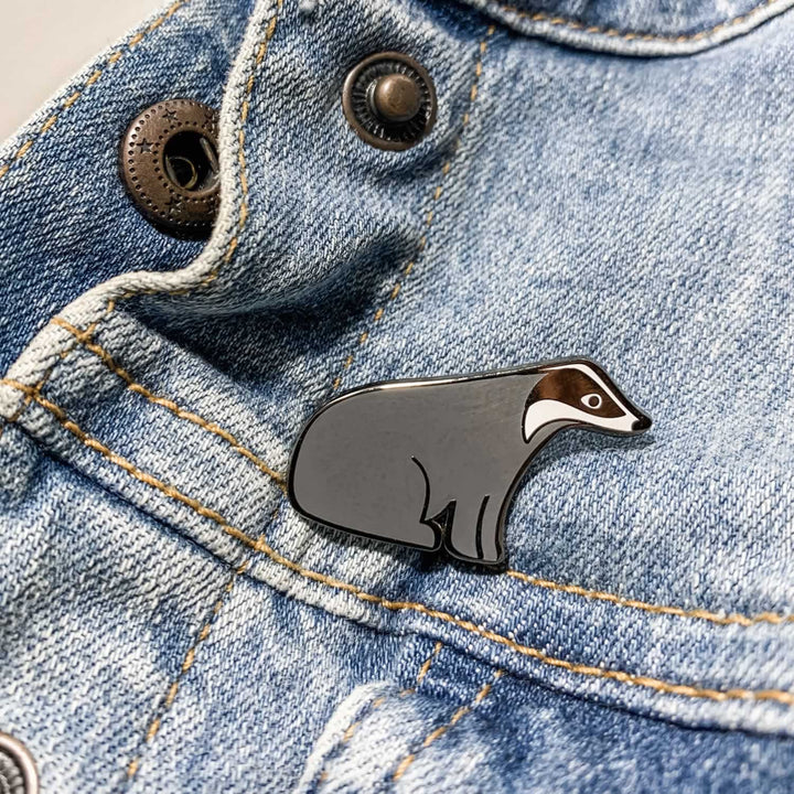 Badger Enamel Pin on Denim